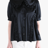 Black t-shirt worn by a person, showing the t-shirt's fit