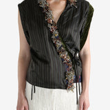 Brown top worn by a person, showing the top fit