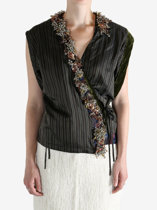 Brown top worn by a person, showing the top fit