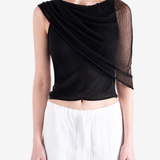 Black top worn by a person, showing the top fit