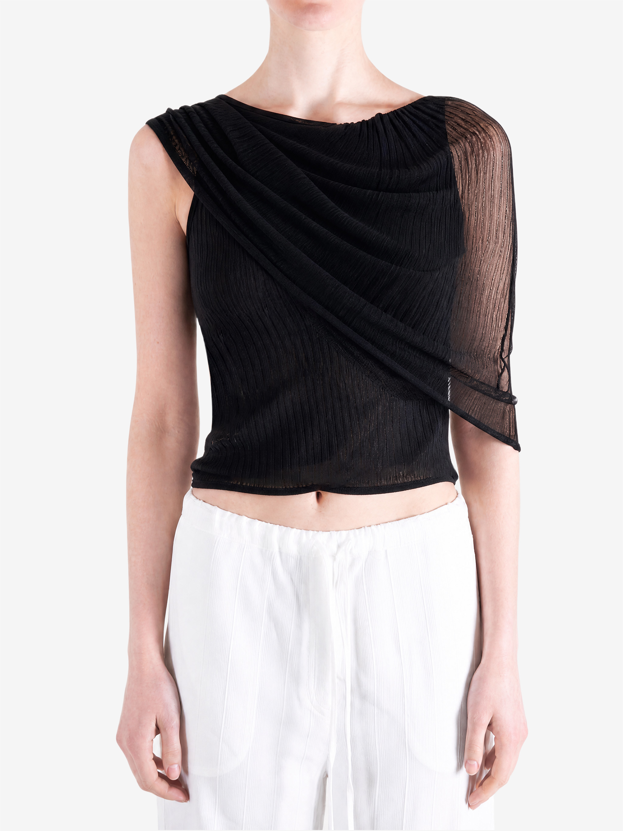 Black top worn by a person, showing the top fit