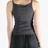 Grey top worn by a person, showing the top fit