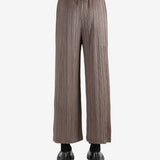 Brown pants worn by a person, showing the pants' fit