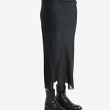 Black skirt worn by a person, shwing the skirt's fit