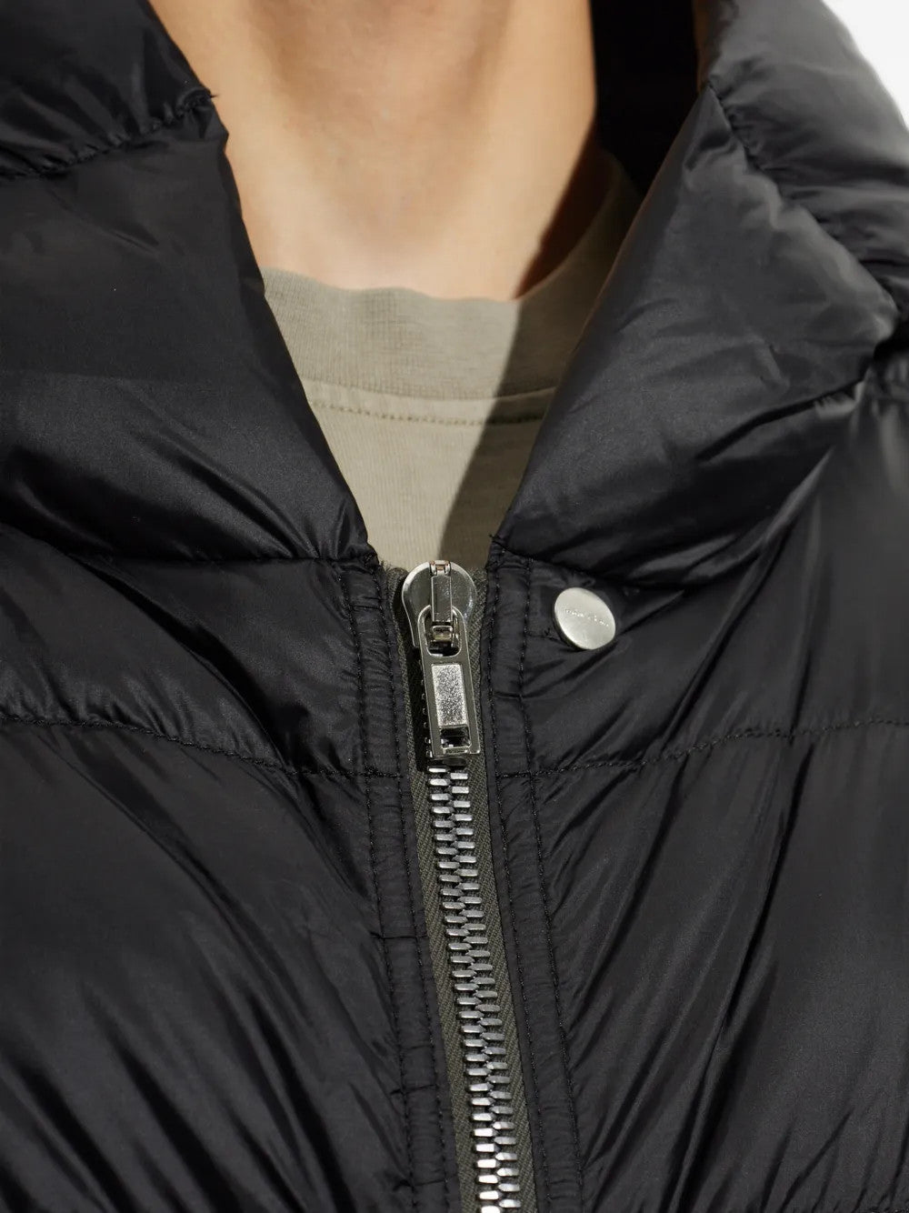 Close up of Black jacket, showing texture of the 100% polyamide fabric