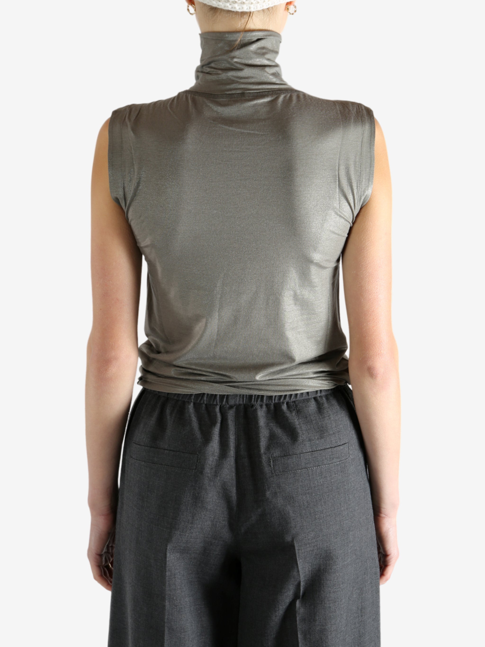 Grey tops worn by a person, showing the tops fit