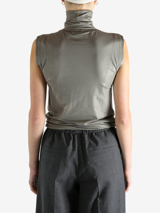 Grey tops worn by a person, showing the tops fit