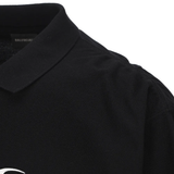 Close up of the black t-shirt, showing texture of the cotton material 
