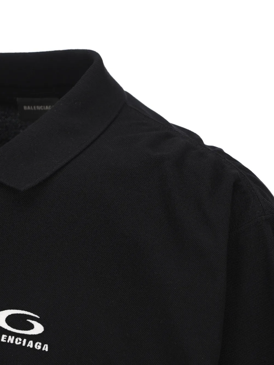 Close up of the black t-shirt, showing texture of the cotton material 