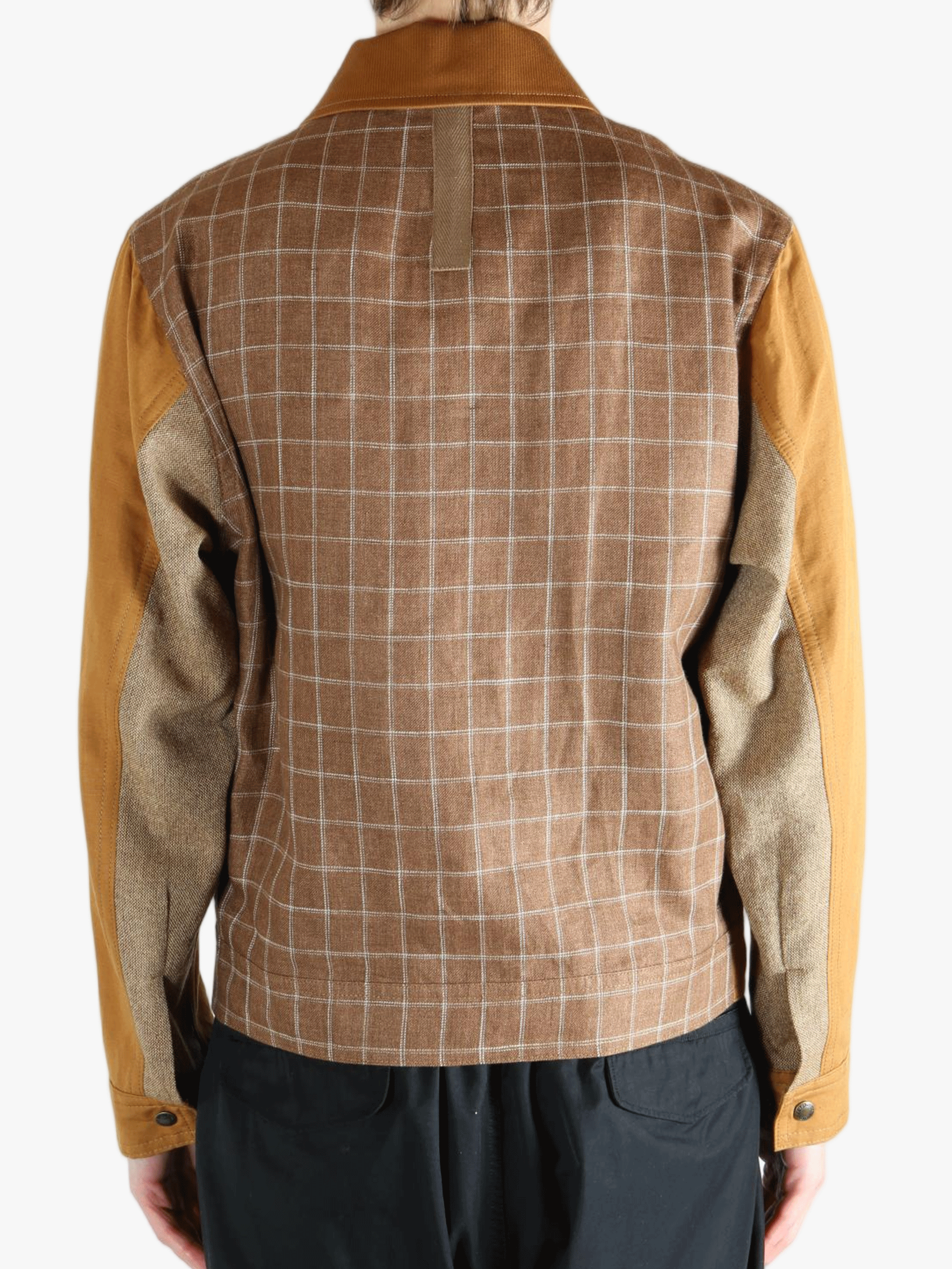 Brown jackets worn by a person, showing the jacket's fit 