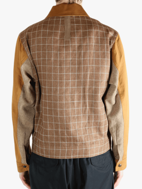 Brown jackets worn by a person, showing the jacket's fit 