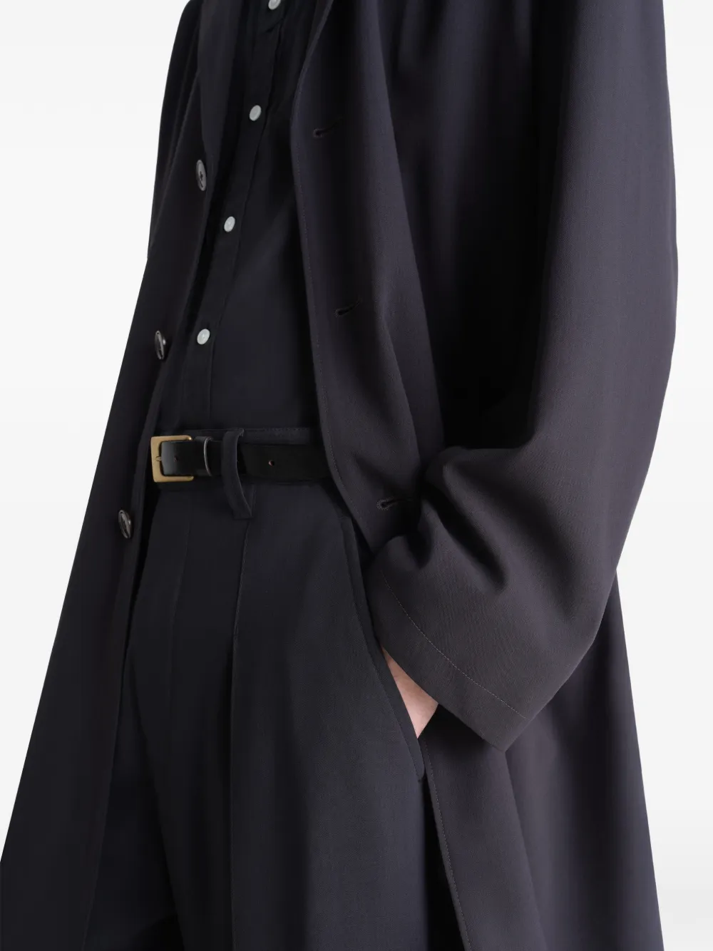 Close up of black coats showing texture of the blended fabric