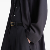 Close up of black coats showing texture of the blended fabric