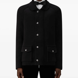 Black jacket worn by a person, showing the jacket fit