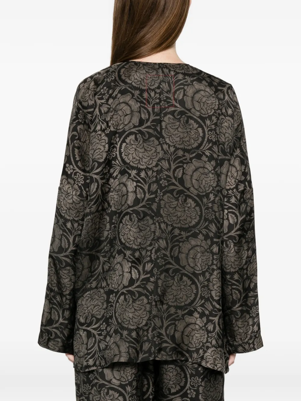 black tops worn by a person, showing the tops fit