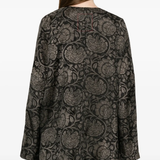 black tops worn by a person, showing the tops fit