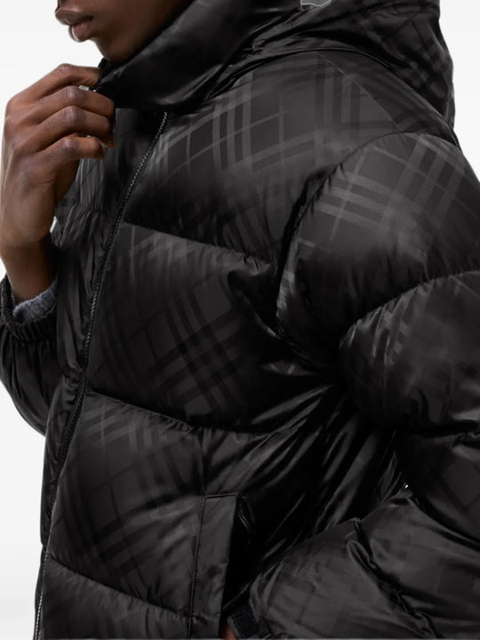 Black jacket worn by a person, showing the jacket fit