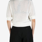 White shirt worn by a person, showing the shirt's fit