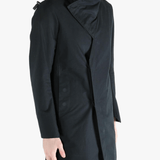 Black jacket worn by a person, showing the jacket's fit