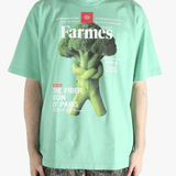 Green t-shirt worn by a person, showing the t-shirt's fit