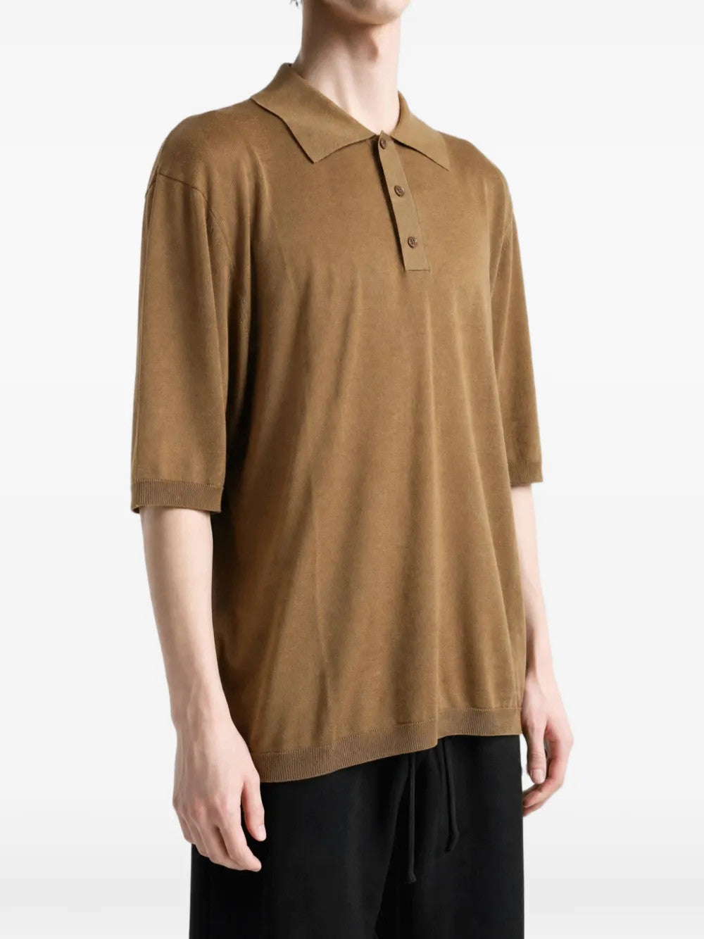 Brown top worn by a person, showing the top fit