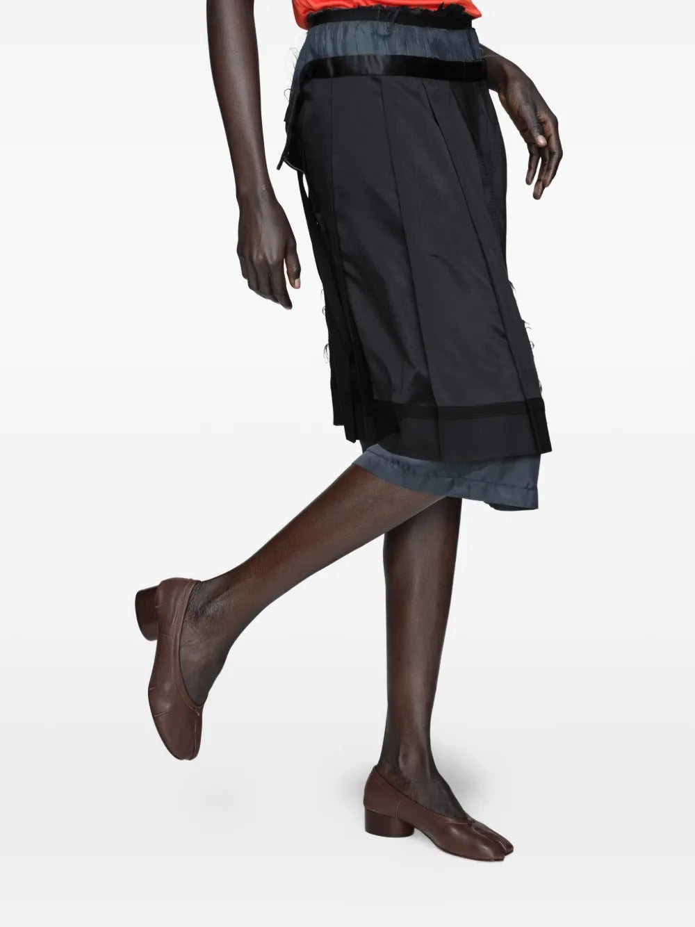 Brown flat worn by a preson, showing shoes' fit