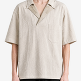 Tan t-shirt worn by a person, showing the t-shirt fit