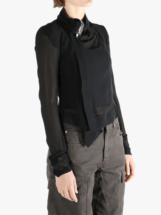 Black long sleeve worn by a person, showing the tight fit.