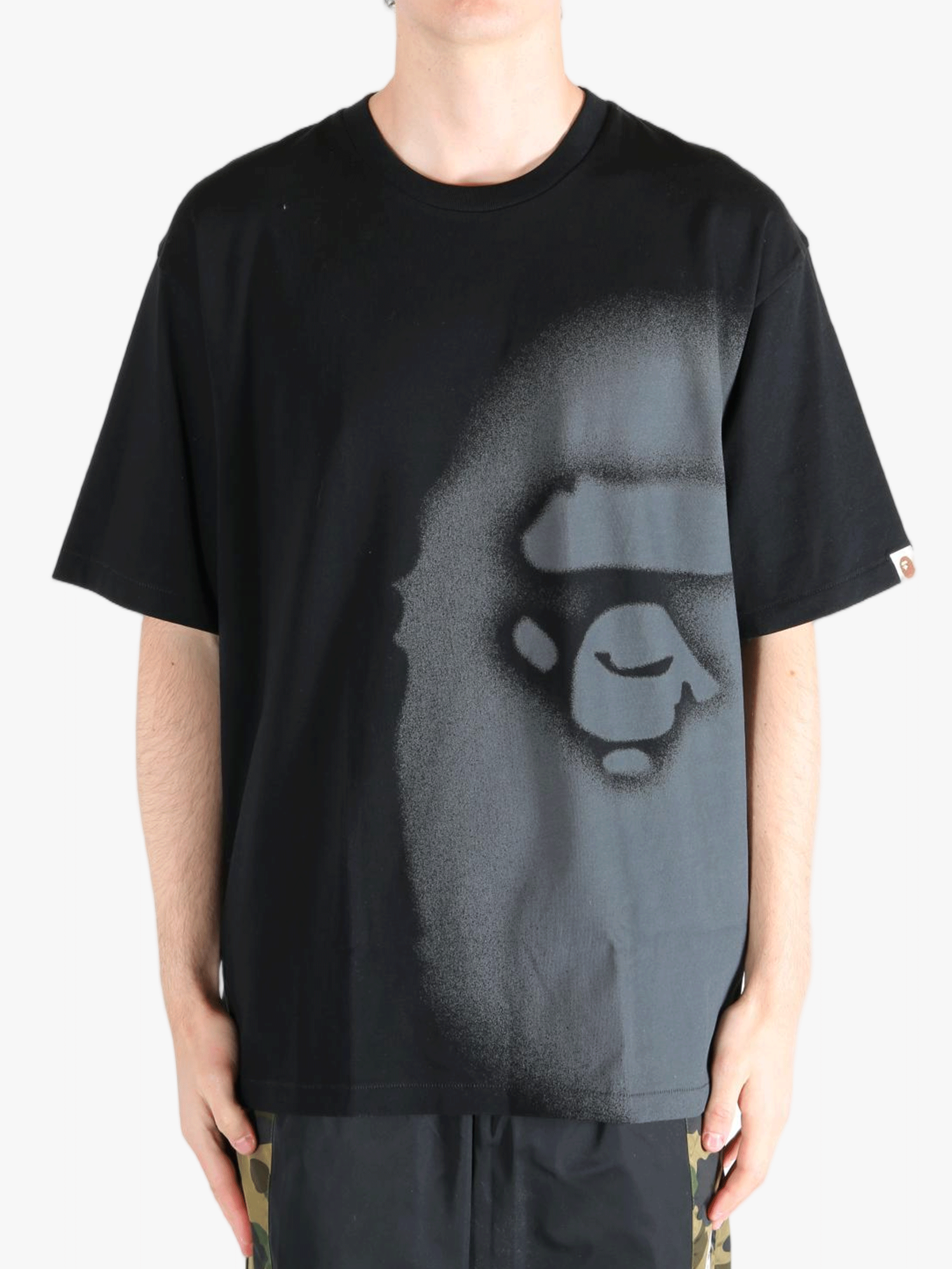 Black t-shirt worn by a person, showing the t-shirt's fit