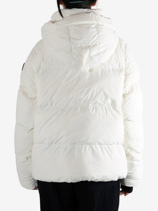 White coat worn by a person, showing the coat's fit