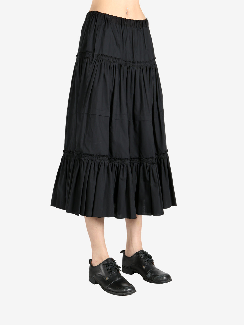Black dresses worn by a person, showing the dresses  fit
