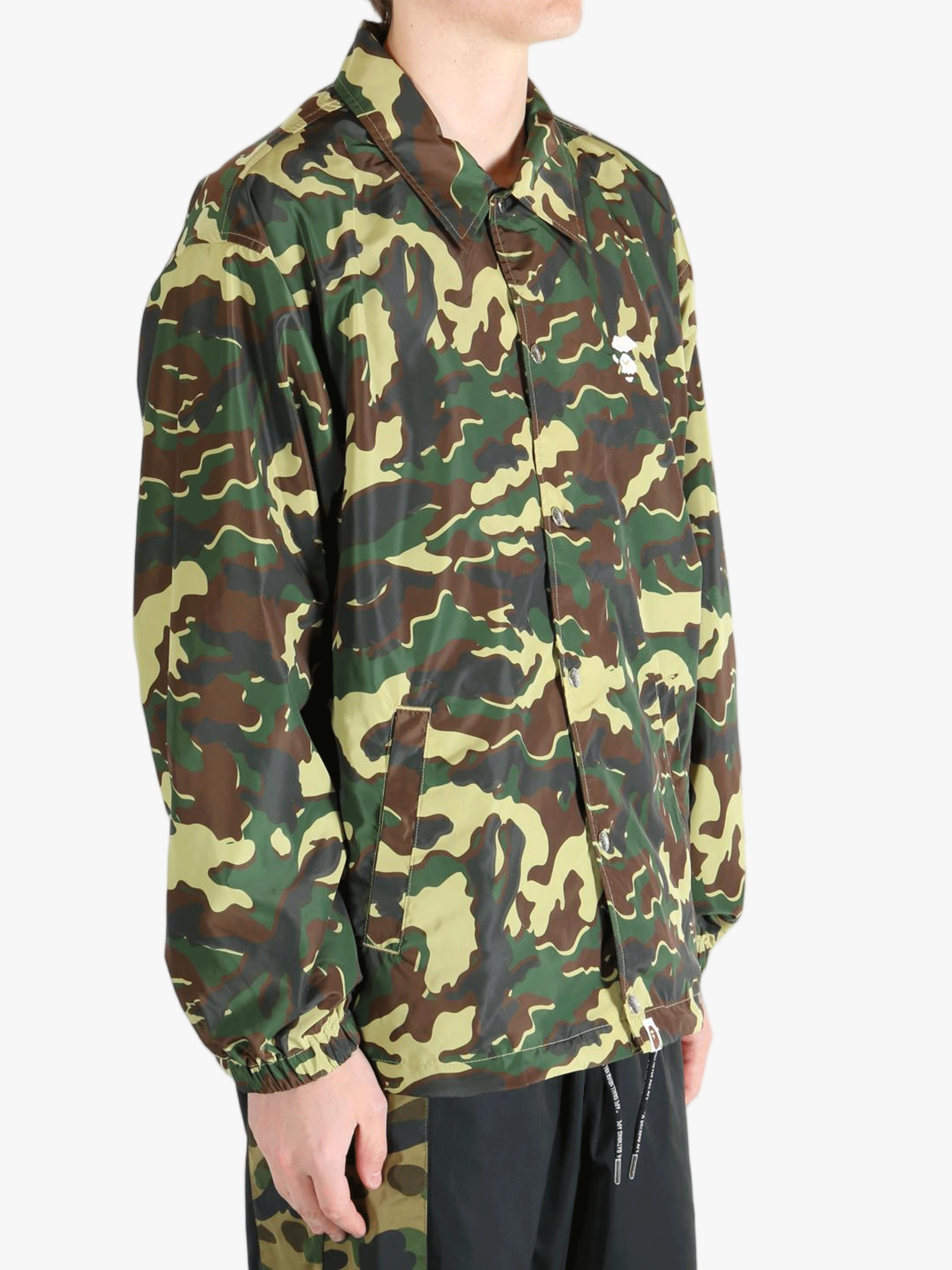 Green jacket worn by a person,showing the jacket's fit