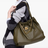 Green bag worn by a person, showing the bag's fit