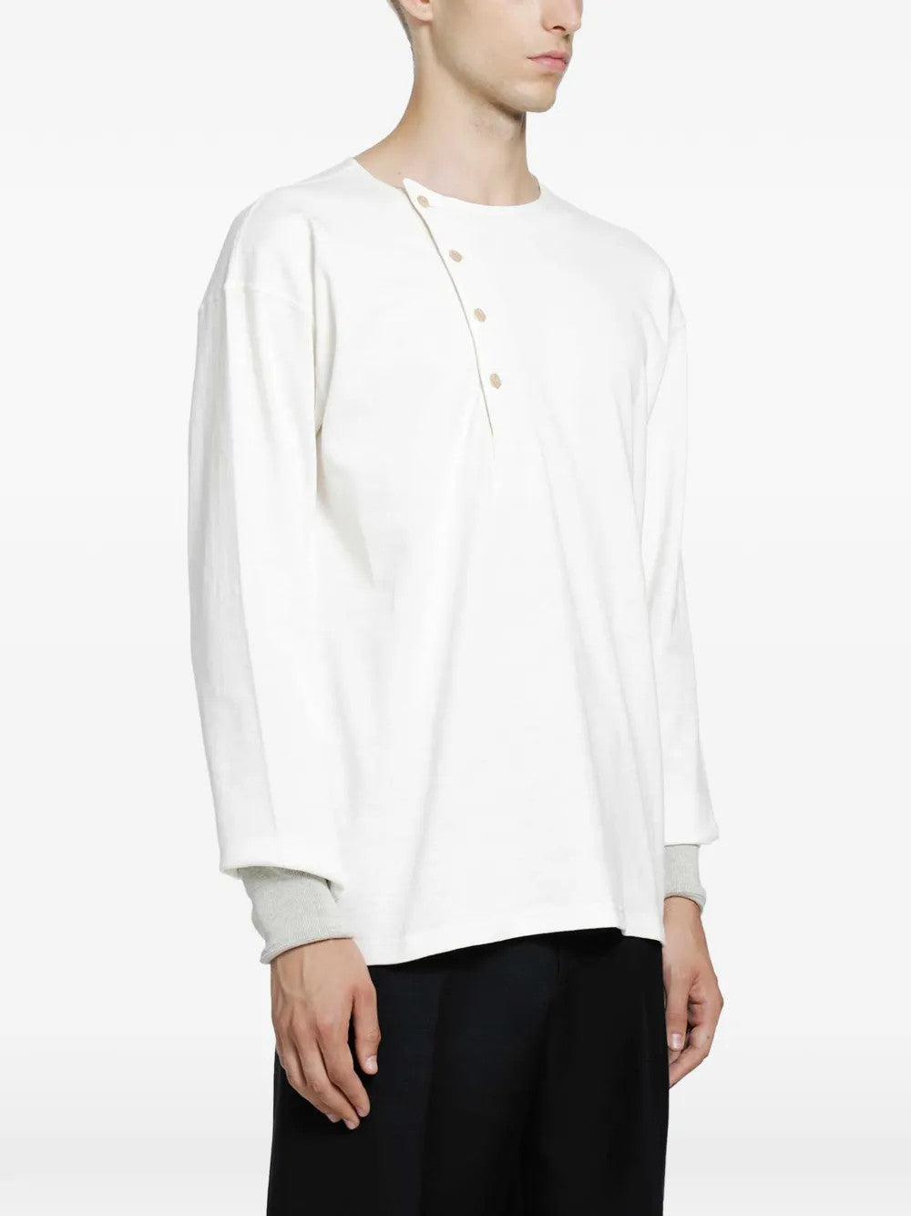 White top worn by a person, showing the top fit