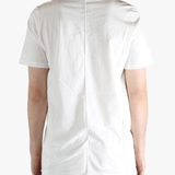 white t-shirts  worn by a person, showing the t-shirts fit