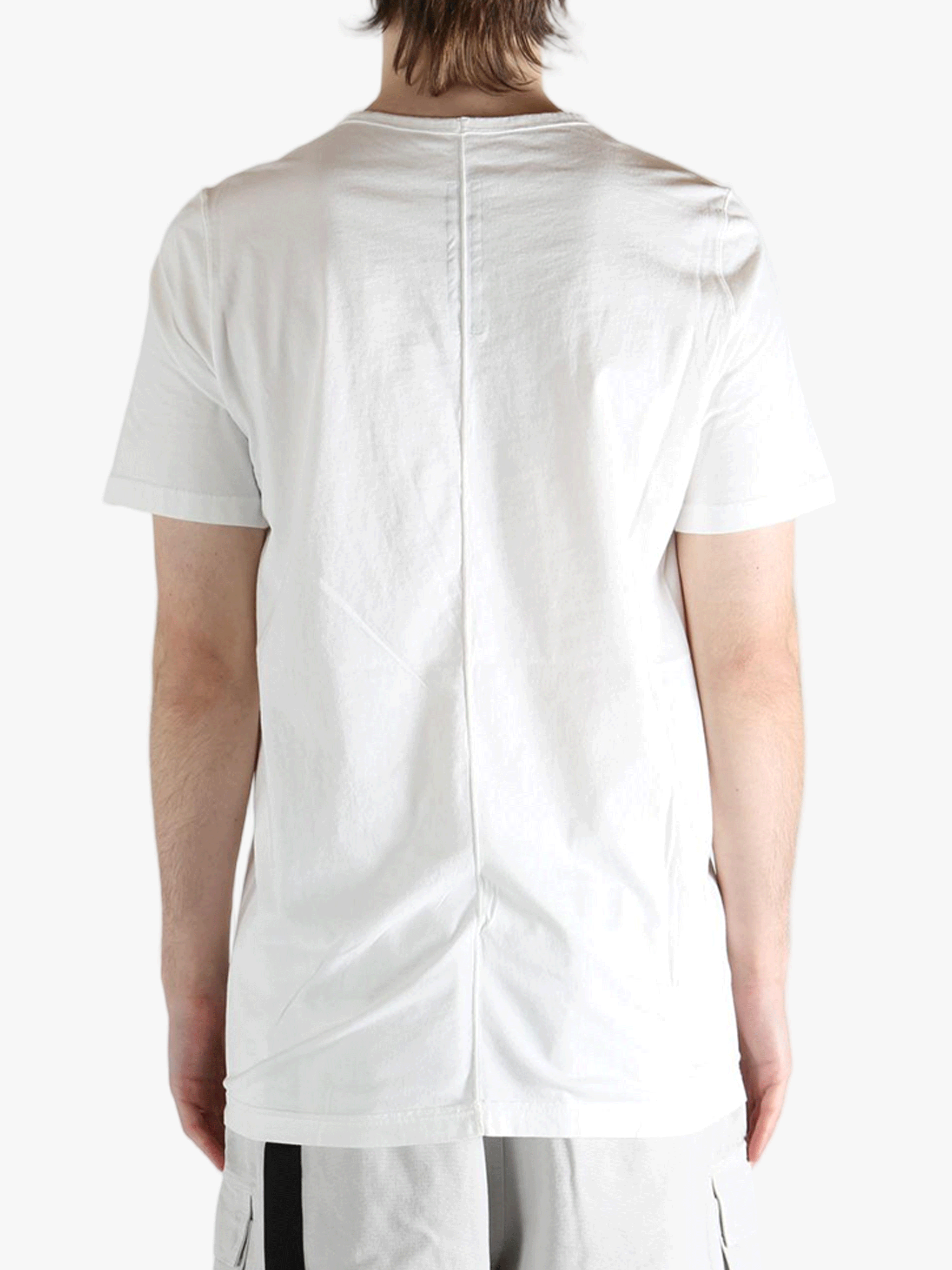 white t-shirts  worn by a person, showing the t-shirts fit
