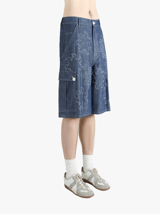 Blue shorts worn by a person, showing the shorts fit