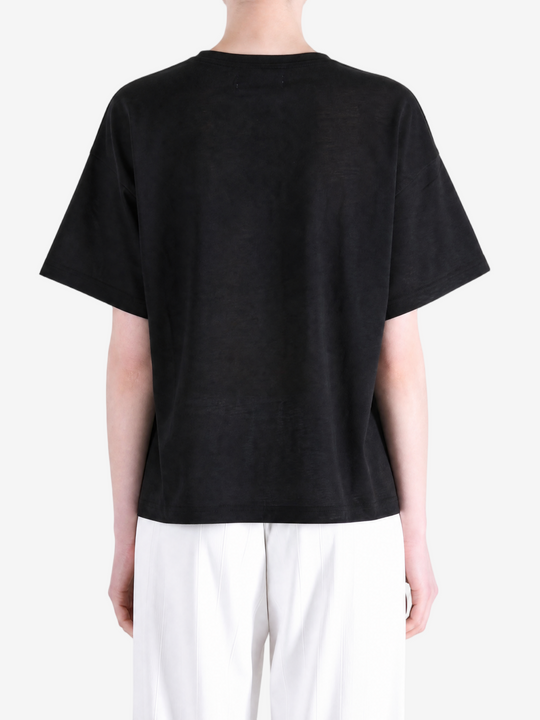 Black t-shirt worn by a person, showing the t-shirt fit