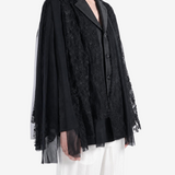 Black jacket worn by a person, showing the jacket fit