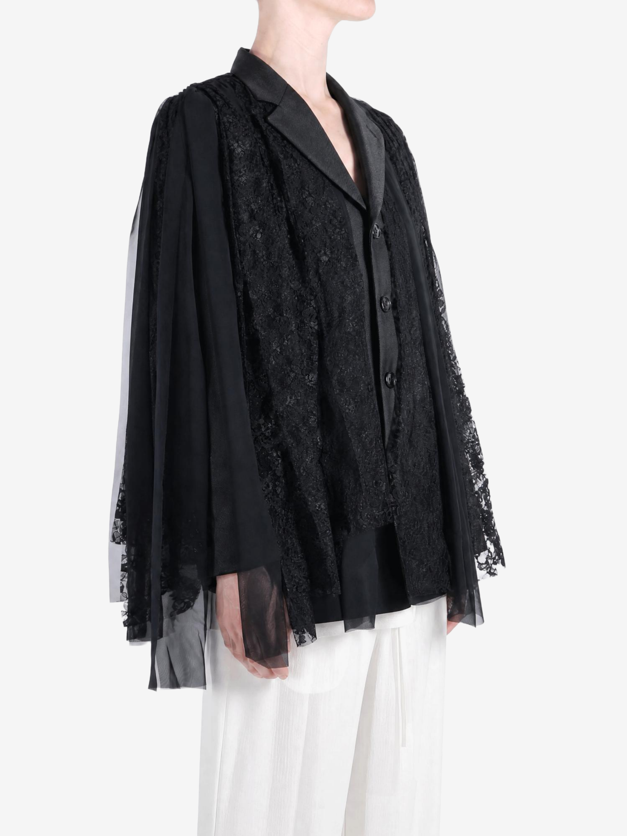 Black jacket worn by a person, showing the jacket fit