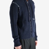 Navy cardigan worn by a person, showing the cardigan's fit