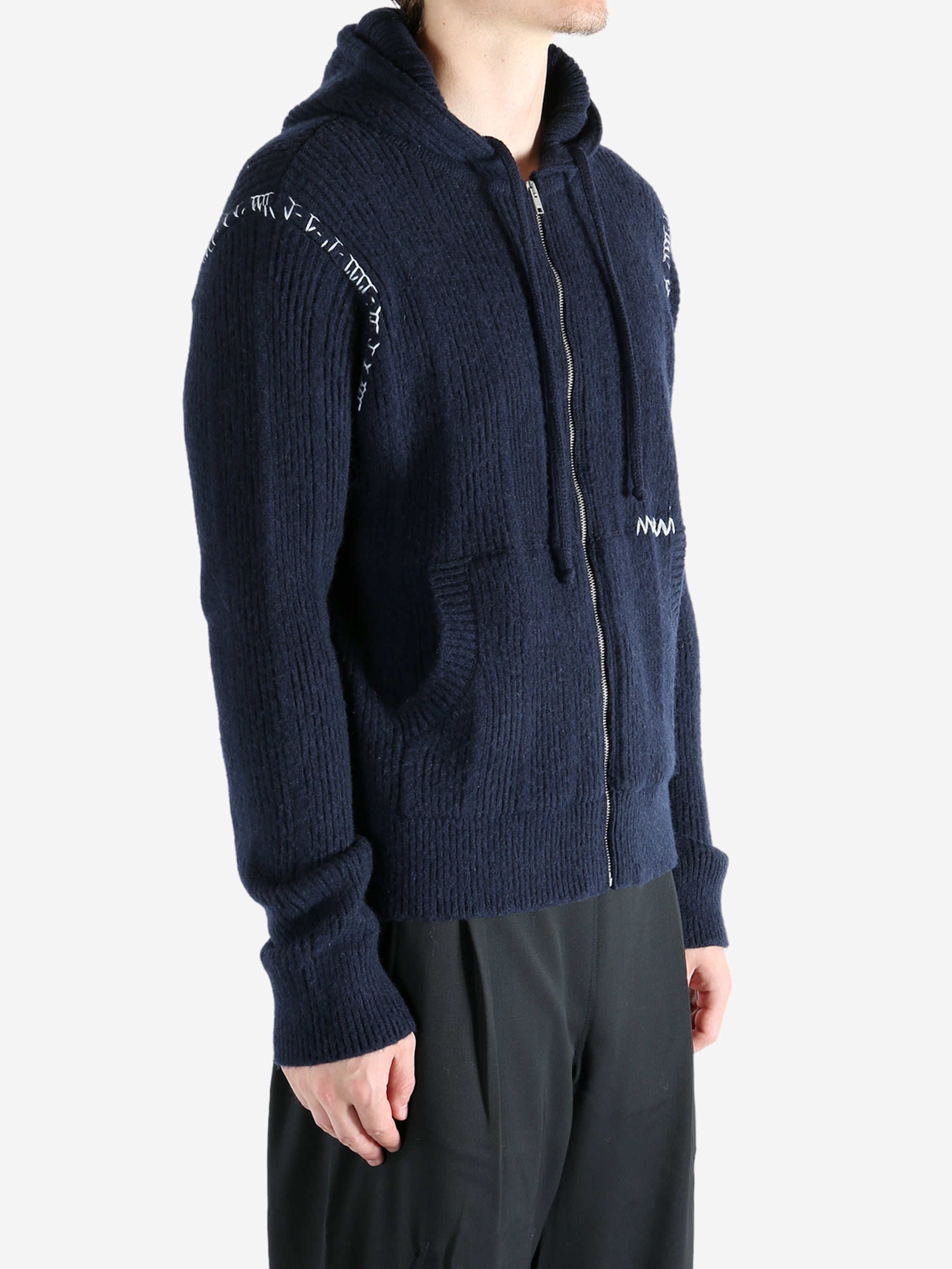 Navy cardigan worn by a person, showing the cardigan's fit