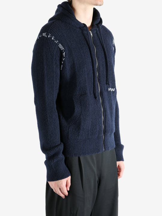 Navy cardigan worn by a person, showing the cardigan's fit