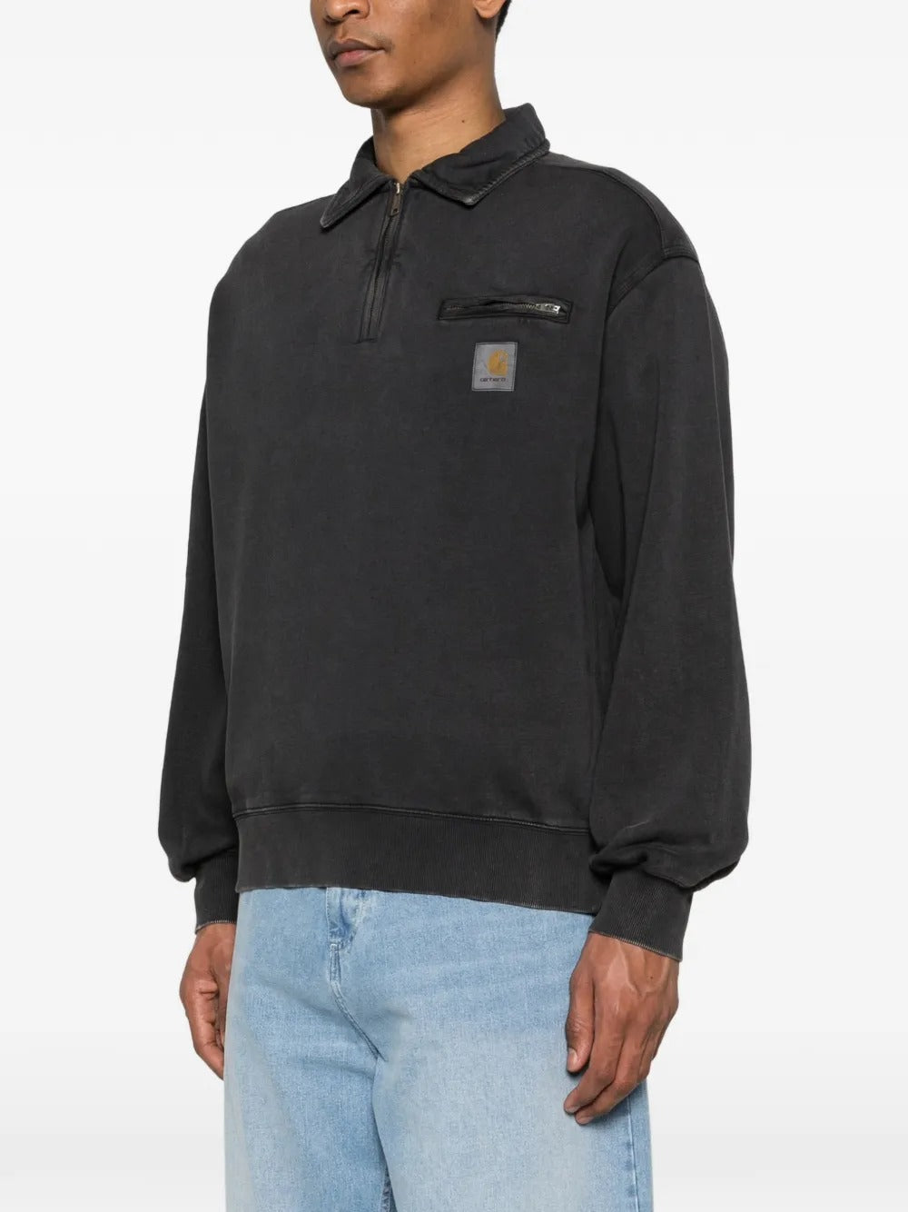 Black sweats worn by a person, showing the sweats' fit