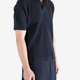 Navy shirt worn by a person, showing the shirt's fit