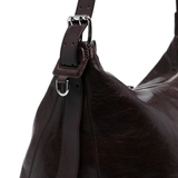 close up of brown bags, showing texture of the leather  fabric
