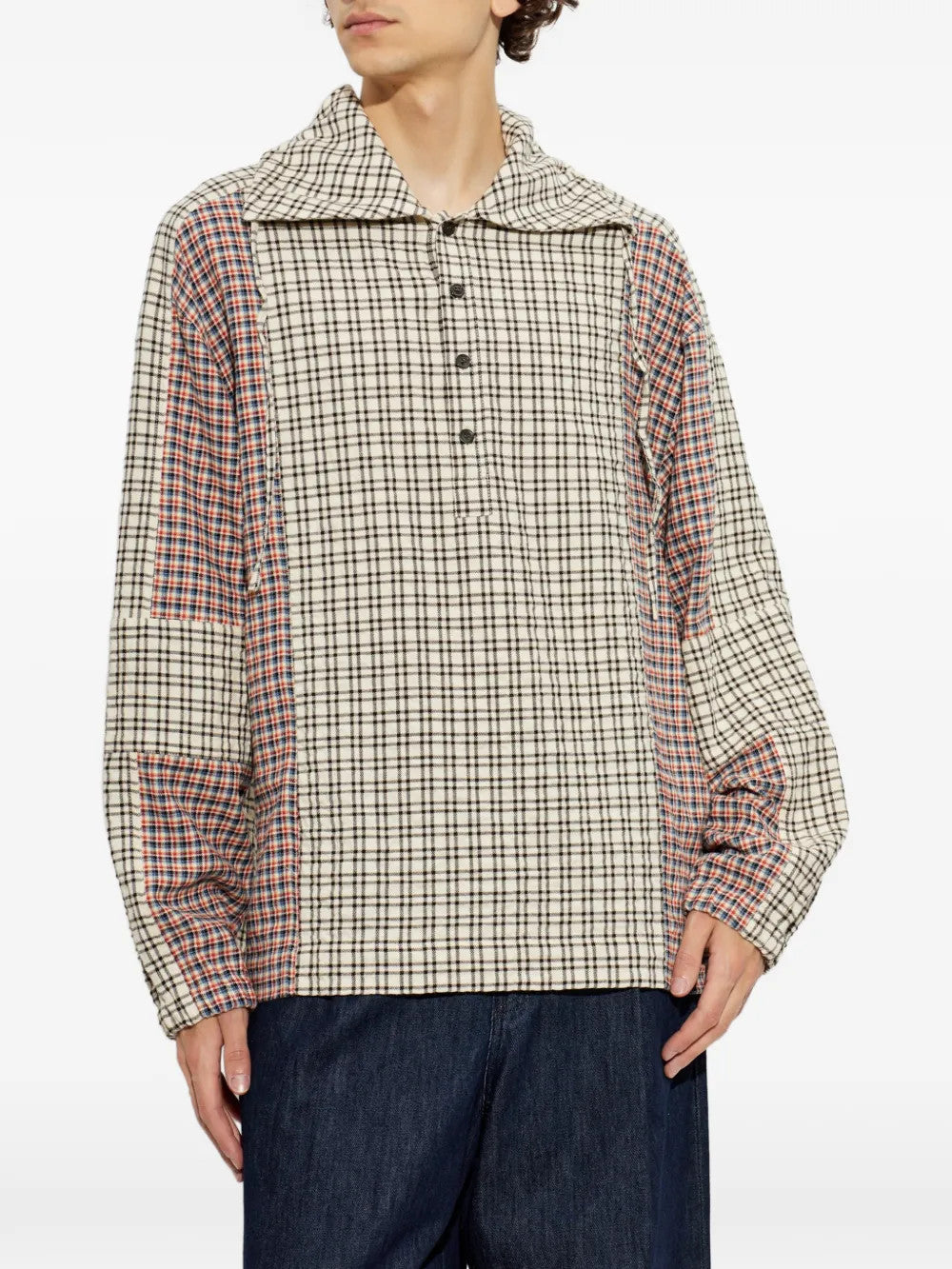 Tan shirt worn by a person, showing the shirt fit