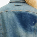 Blue jacket worn by a person, showing the jacket fit