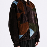 Brown jacket worn by a person, showing the jacket fit