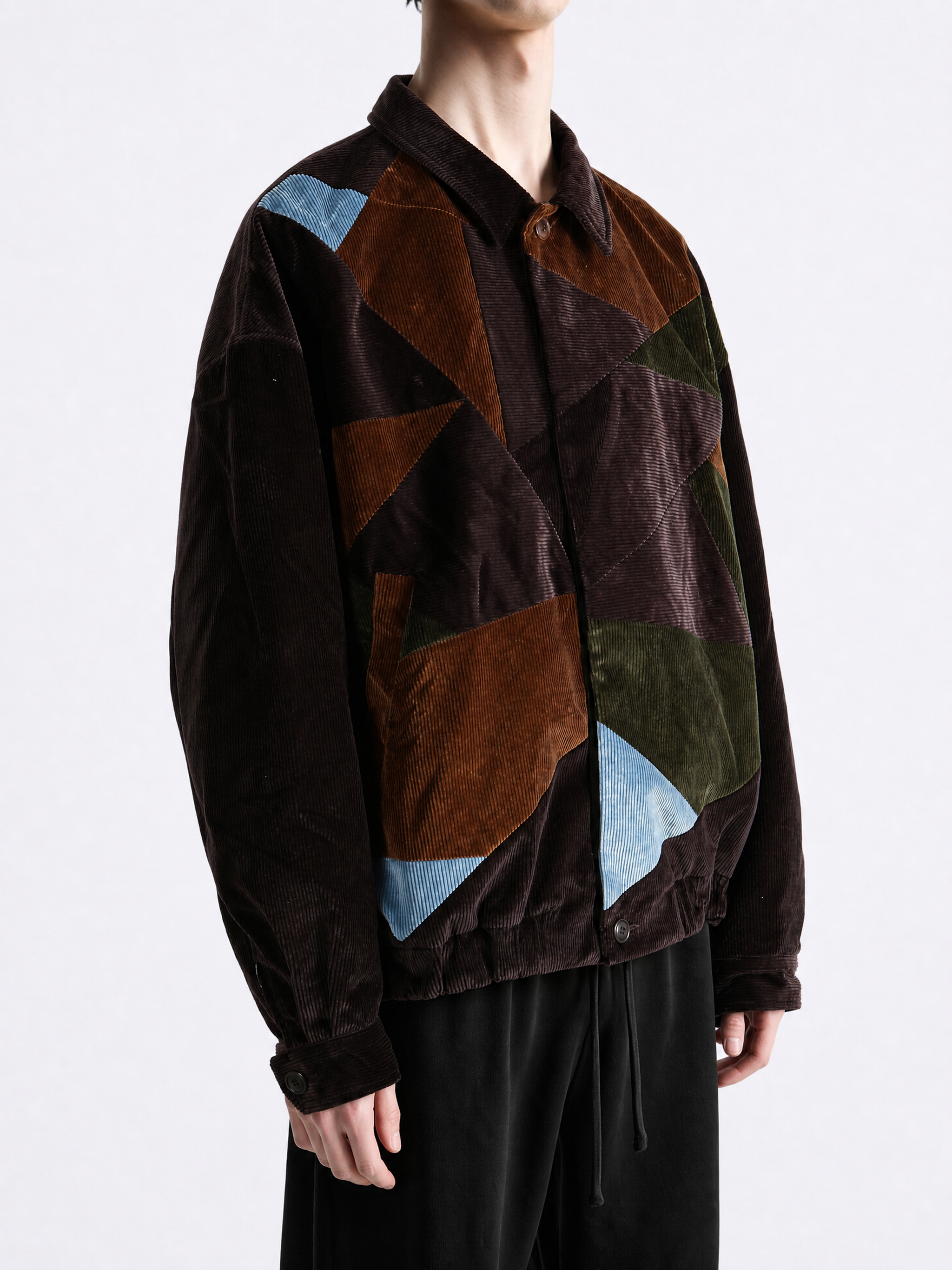 Brown jacket worn by a person, showing the jacket fit